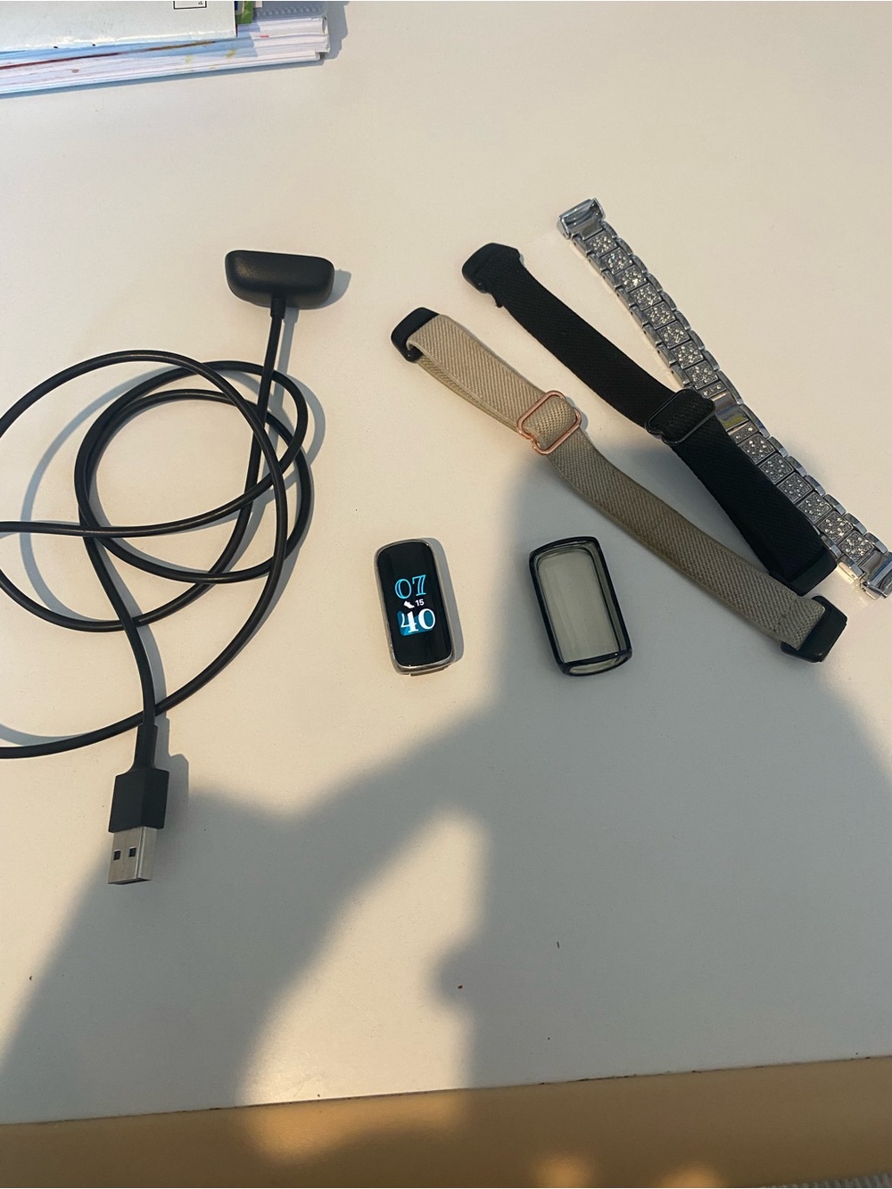 Fitbit Luxe Tracker with accessories and charger
